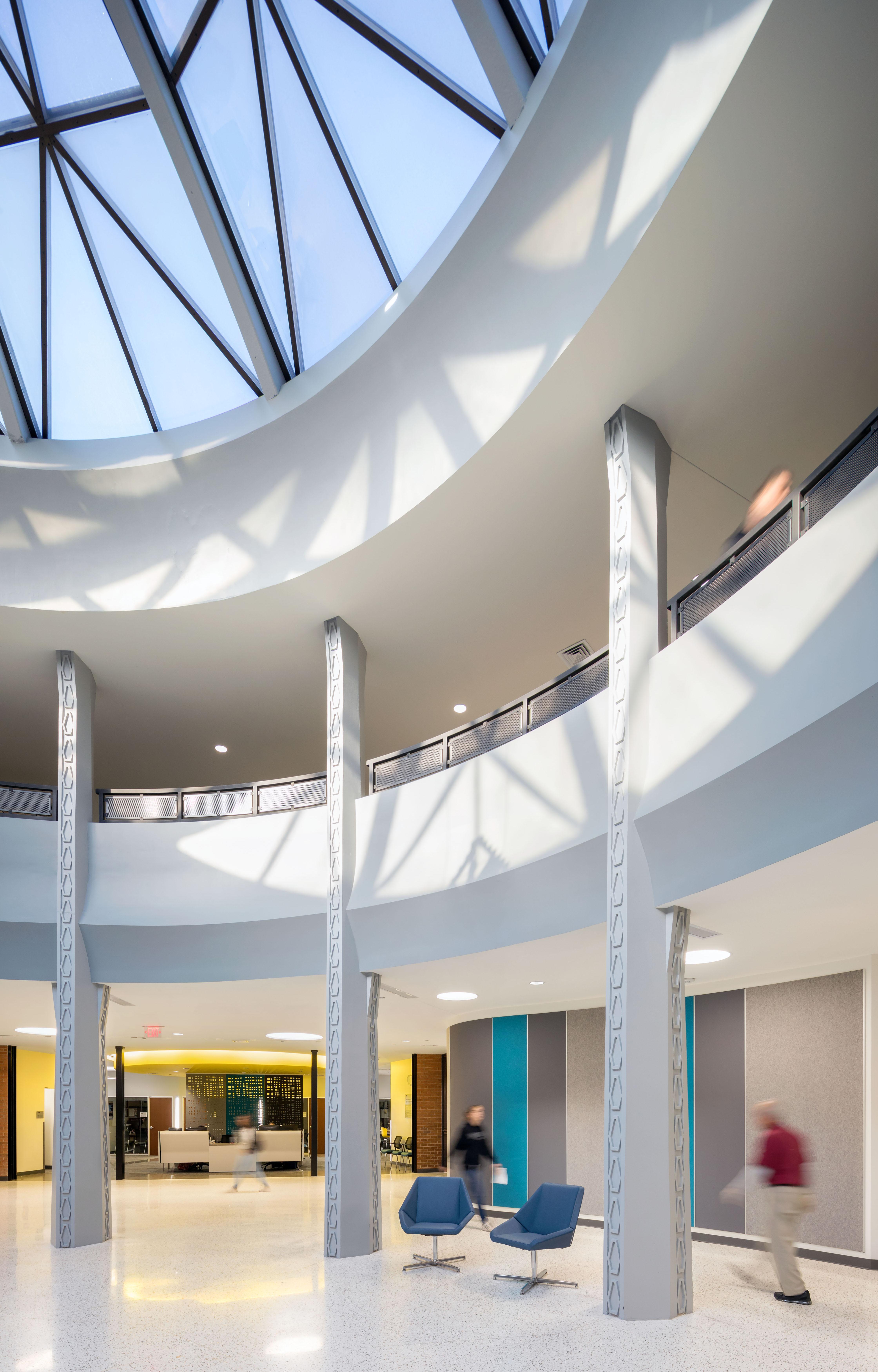 Armstrong Hall photo from the inside with white walls and glass ceiling