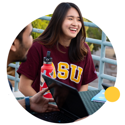 ASU student visits with classmates outside.